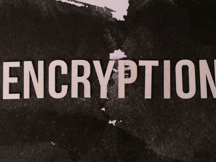 Black and white abstract image with the word 'ENCRYPTION' prominently displayed.