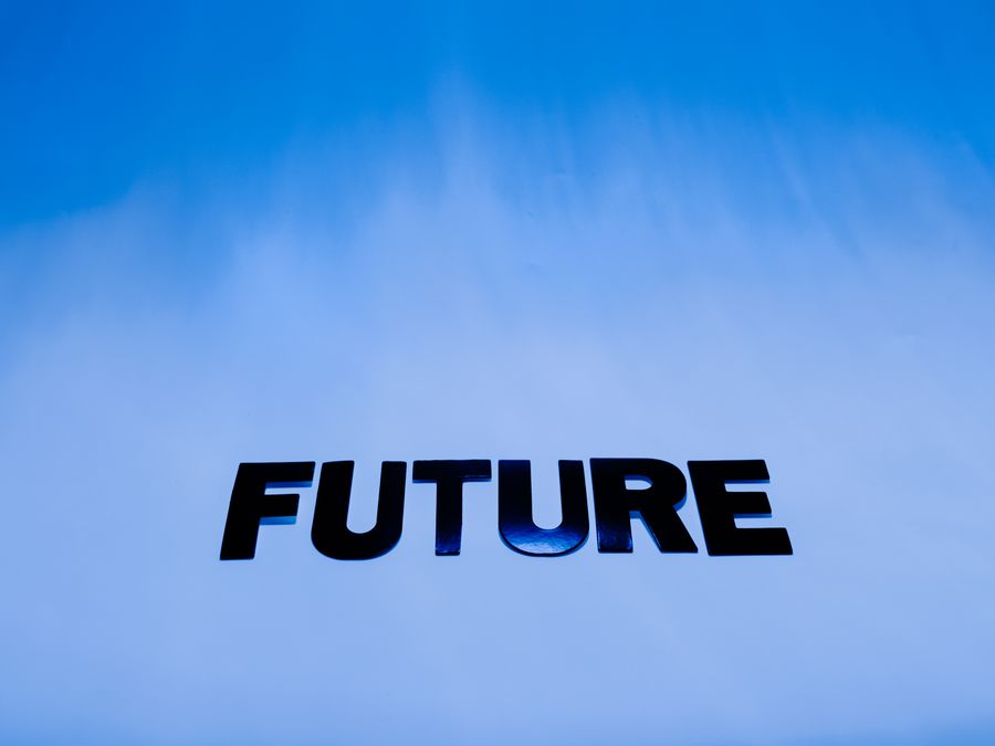 The word 'Future' in bold letters against a bright blue abstract background.