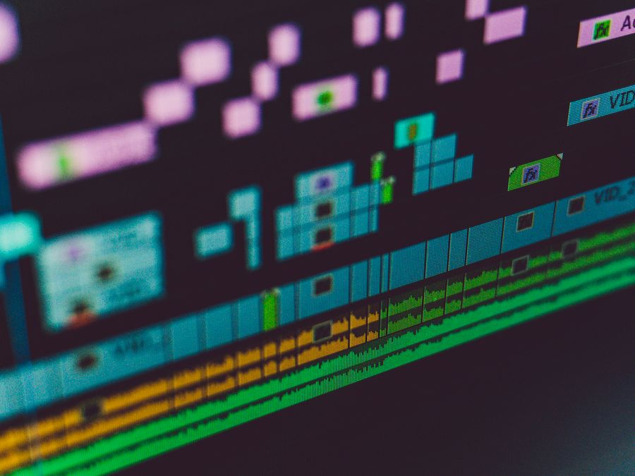 Detailed view of a video editing software interface showing multi-track timeline and colorful design.