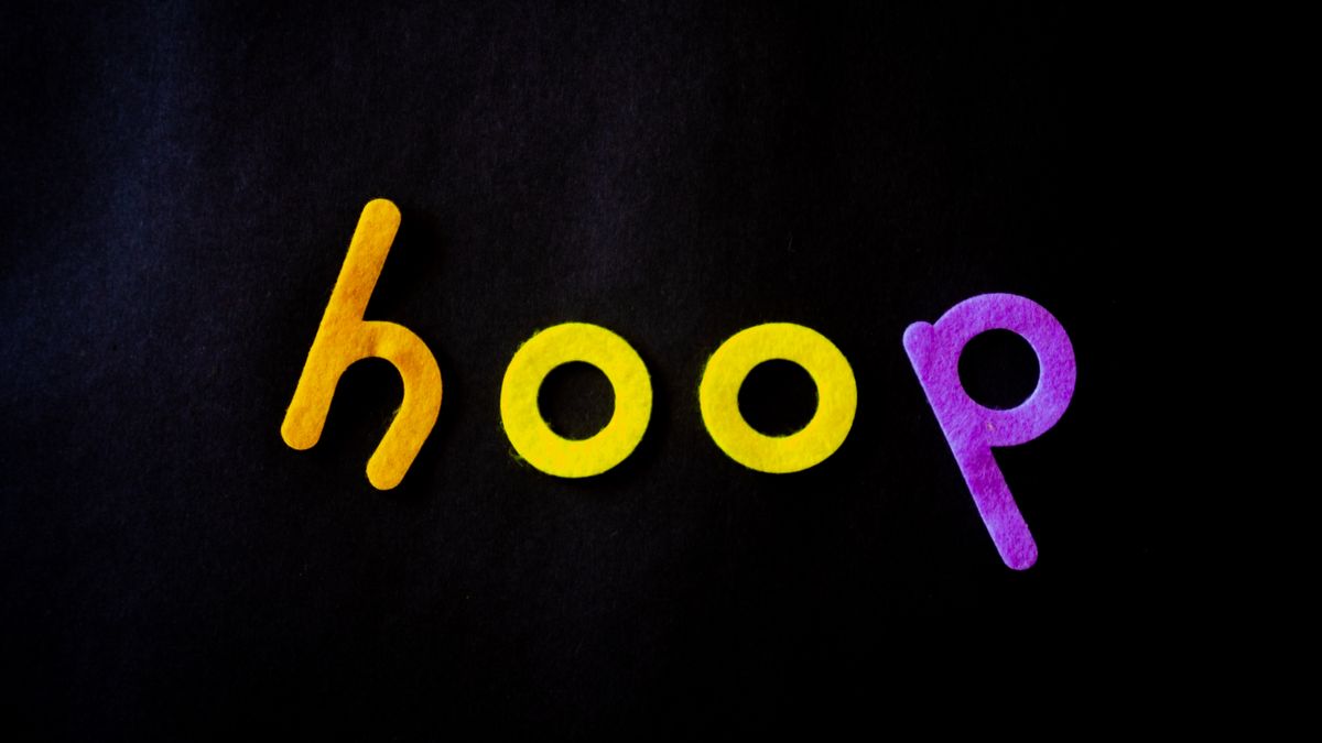 Vibrant colored letters spelling 'hoop' on a dark black background. Perfect for creative design projects.