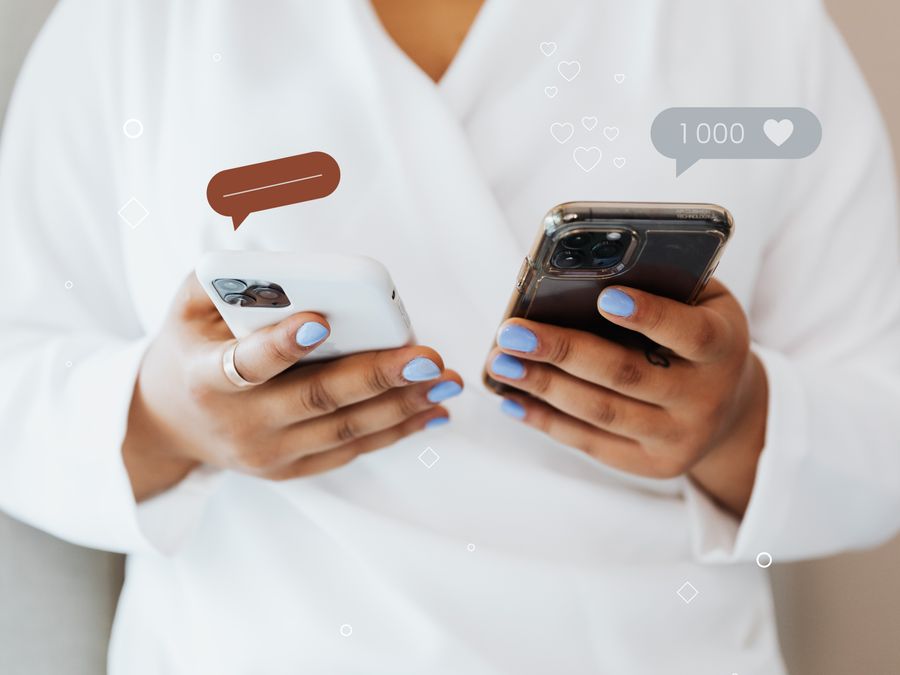 A woman in a white robe interacts with two smartphones, showcasing social media engagement icons.