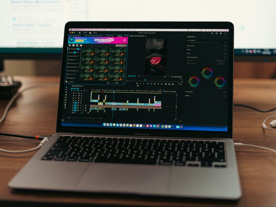 MacBook Air setup with video editing software open, showcasing a typical workspace environment.