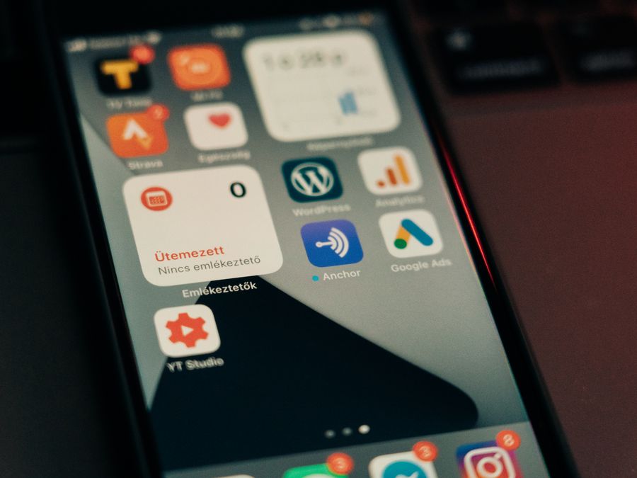 Close-up view of smartphone screen featuring various app icons and notifications.