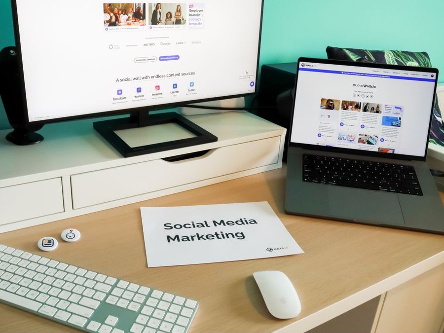 Stylish workspace with laptop and monitor for social media marketing.