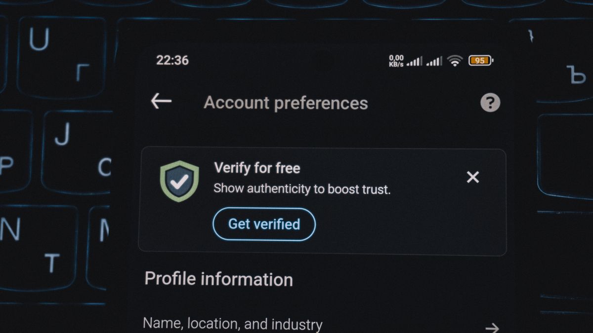 Close-up of a smartphone screen displaying account verification alert. Ideal for security and authenticity themes.