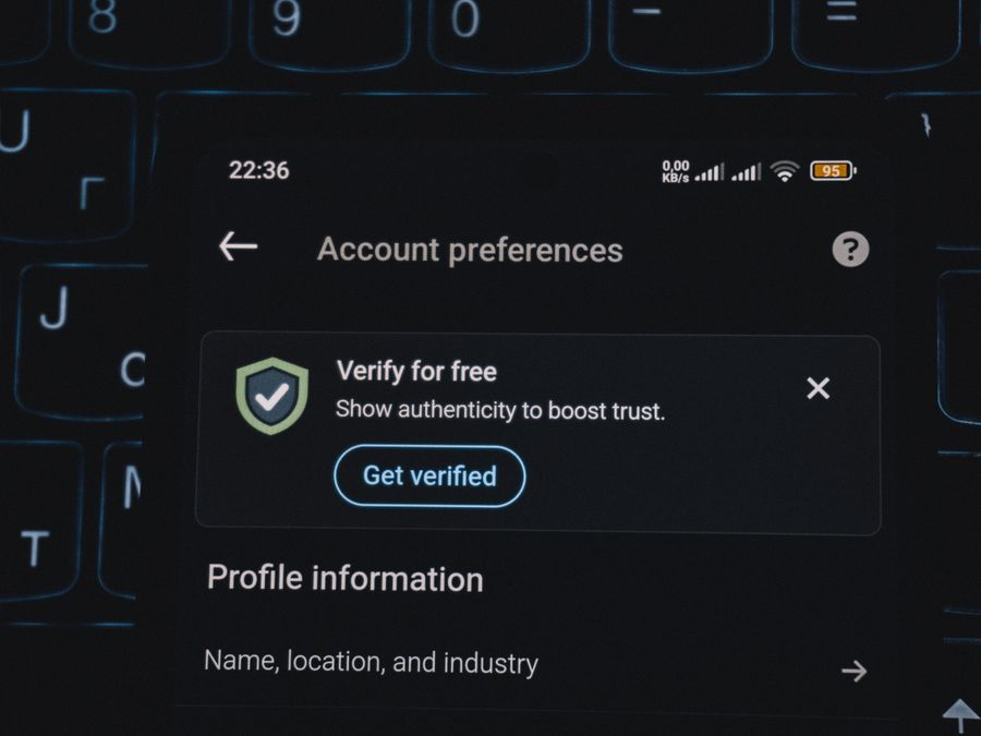 Close-up of a smartphone screen displaying account verification alert. Ideal for security and authenticity themes.