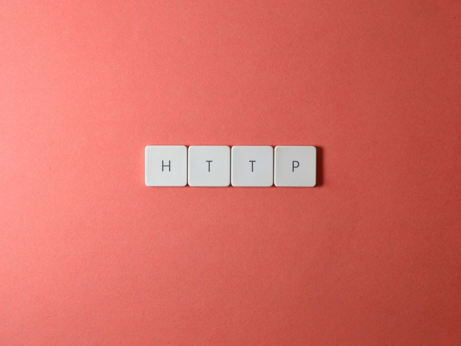 HTTP spelled with keyboard keys on a pink background, minimalist style.